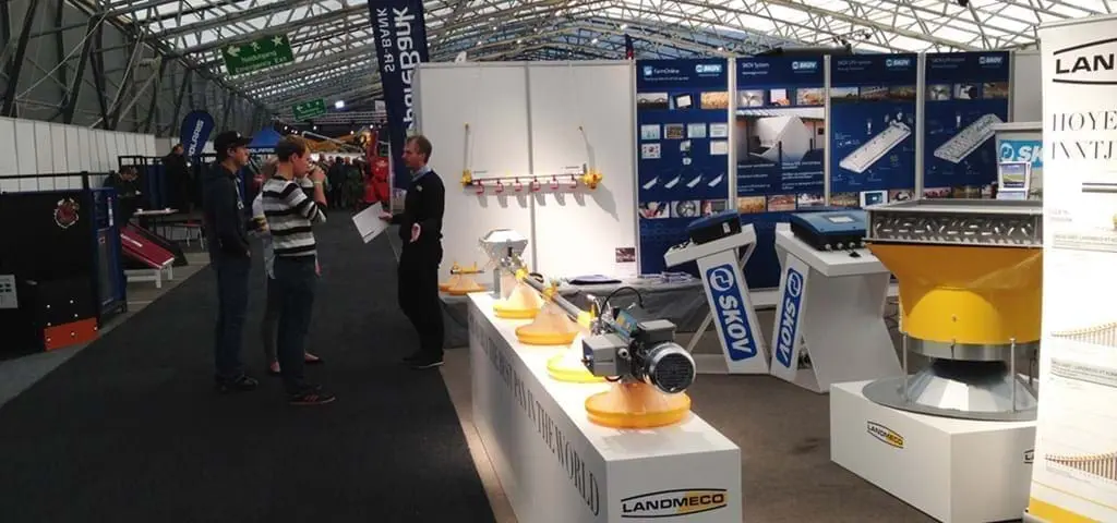 LANDMECO exhibition stand featuring advanced poultry feeding systems, SKOV automation, and professional consultation.