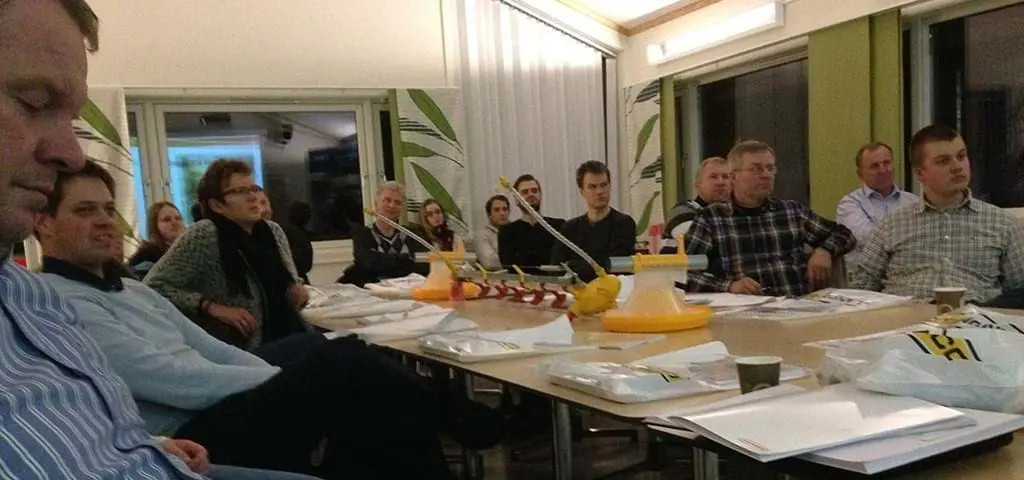 LANDMECO experts and partners reviewing automated poultry feeding systems at a technical product training session.