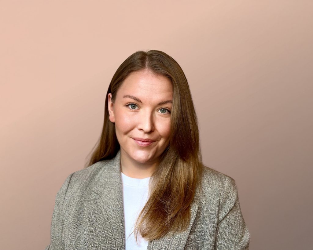 Professional headshot of Karolina Karbowska, LANDMECO poultry expert for the Polish market, in a gray blazer.