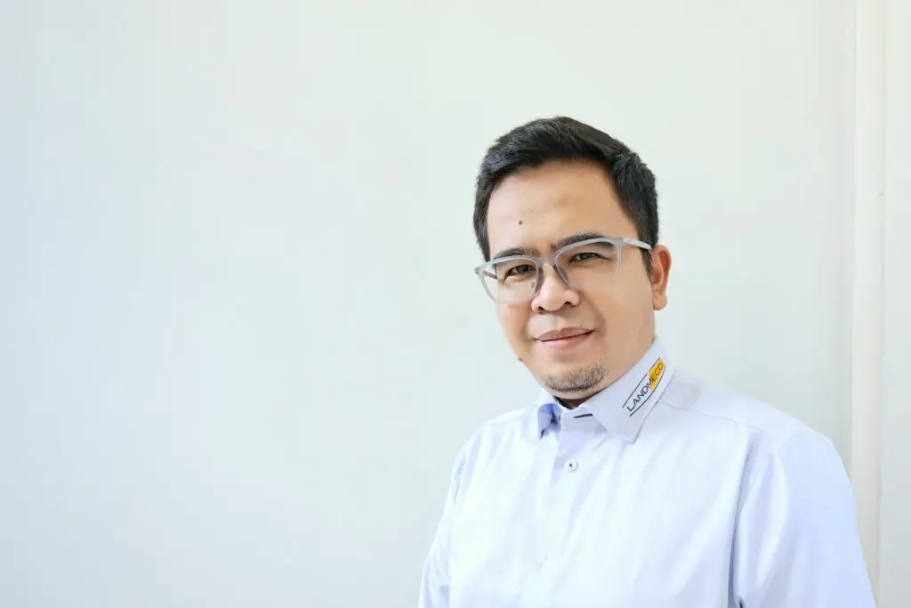 Portrait of Arfiyan Sudrajat, LANDMECO Area Sales Manager for Indonesia, in a professional branded shirt.