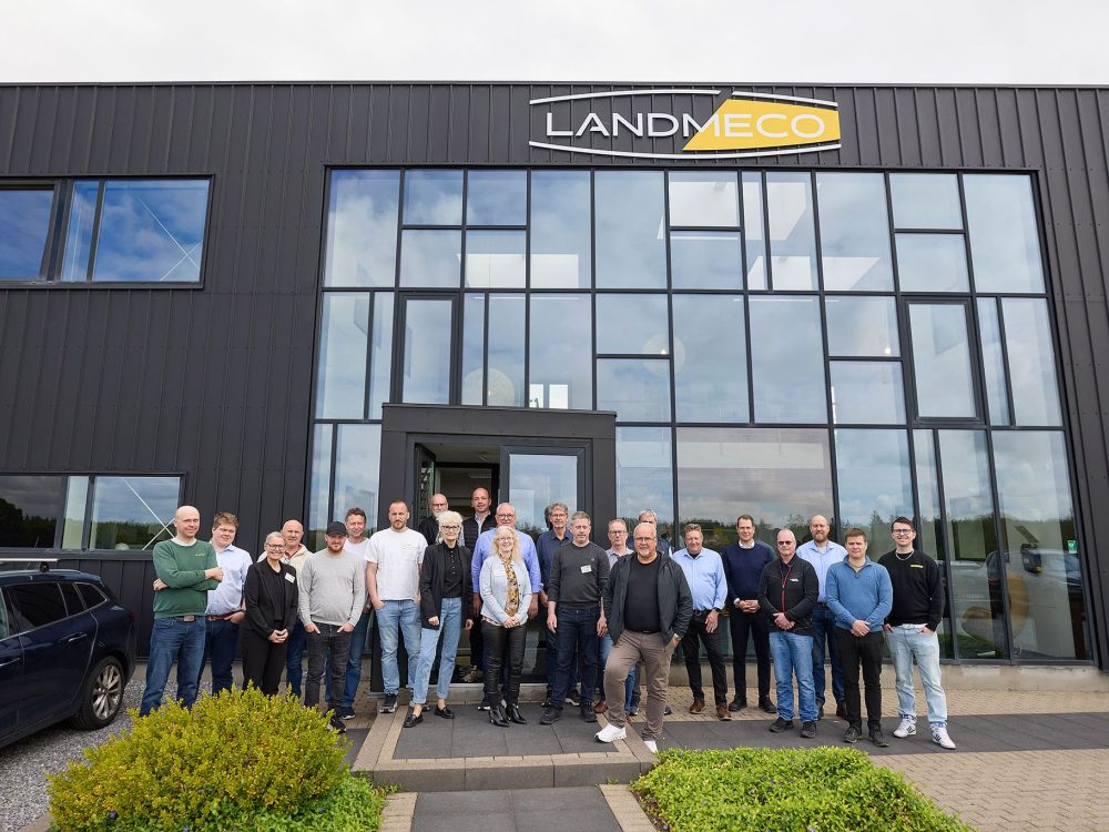 Group of Norwegian and Swedish poultry equipment dealers outside LANDMECO headquarters during a technical seminar.