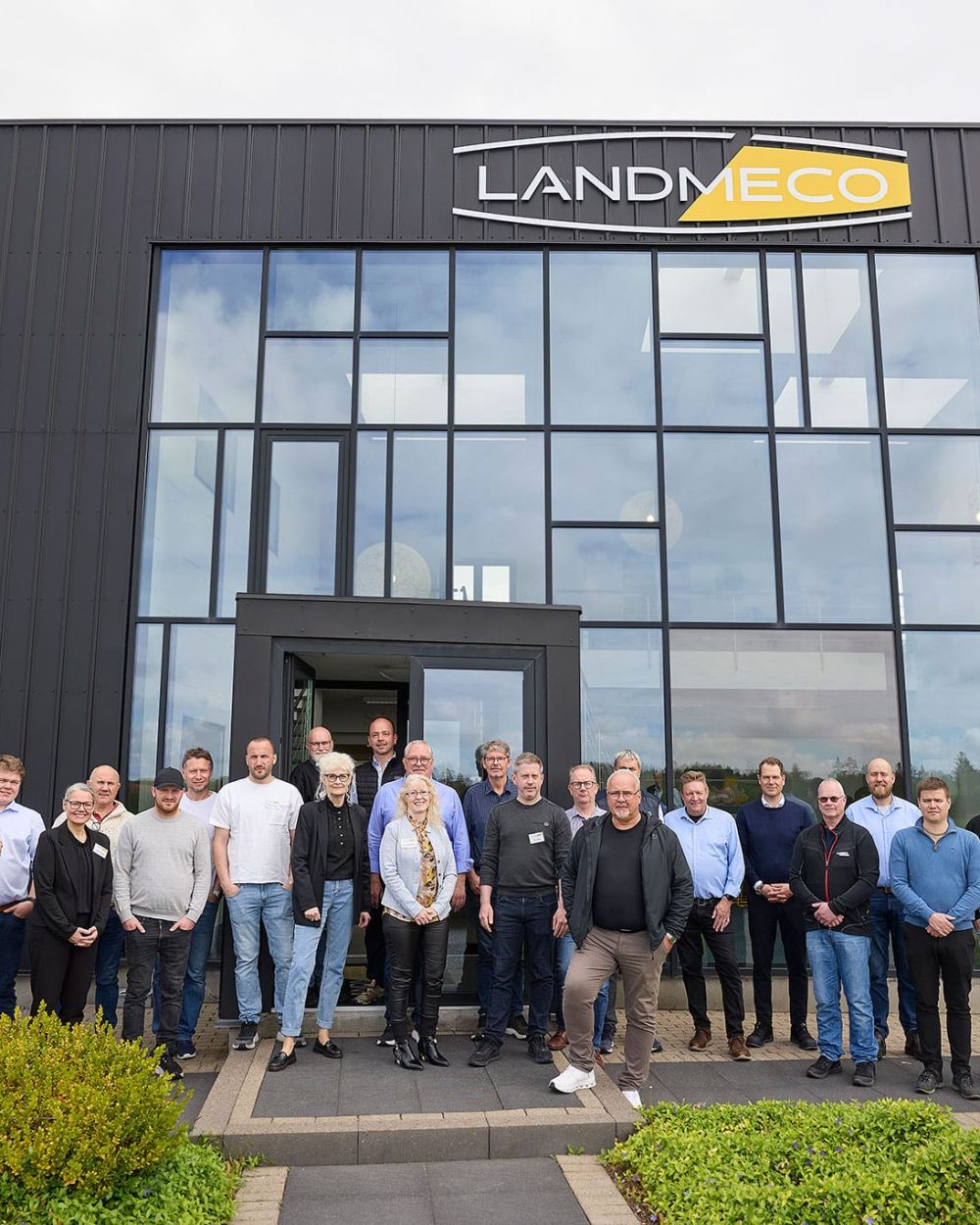 Group of Norwegian and Swedish poultry equipment dealers outside LANDMECO headquarters during a technical seminar.
