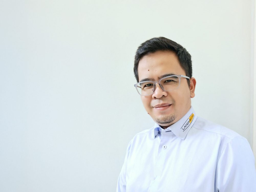 Portrait of Arfiyan Sudrajat, LANDMECO Area Sales Manager for Indonesia, in a professional branded shirt.