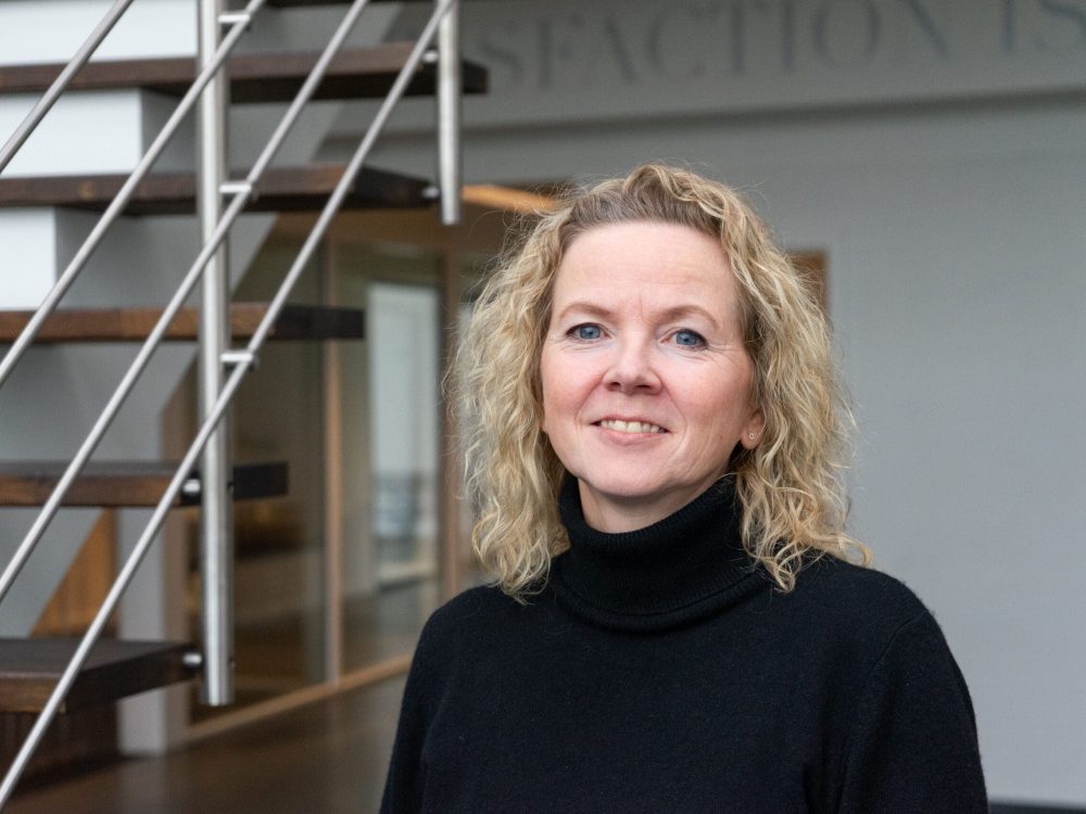 Birgit, Quotation Specialist at LANDMECO poultry equipment manufacturer, in a professional office setting.