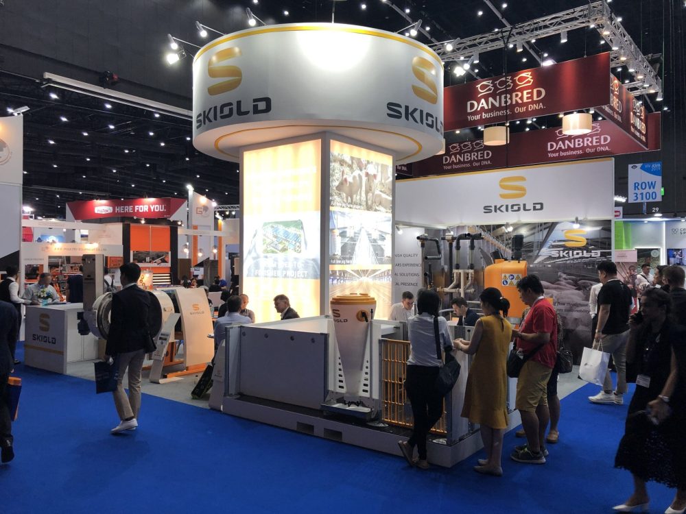 SKIOLD booth at VIV Asia trade show, featuring LANDMECO poultry equipment and automated livestock systems.