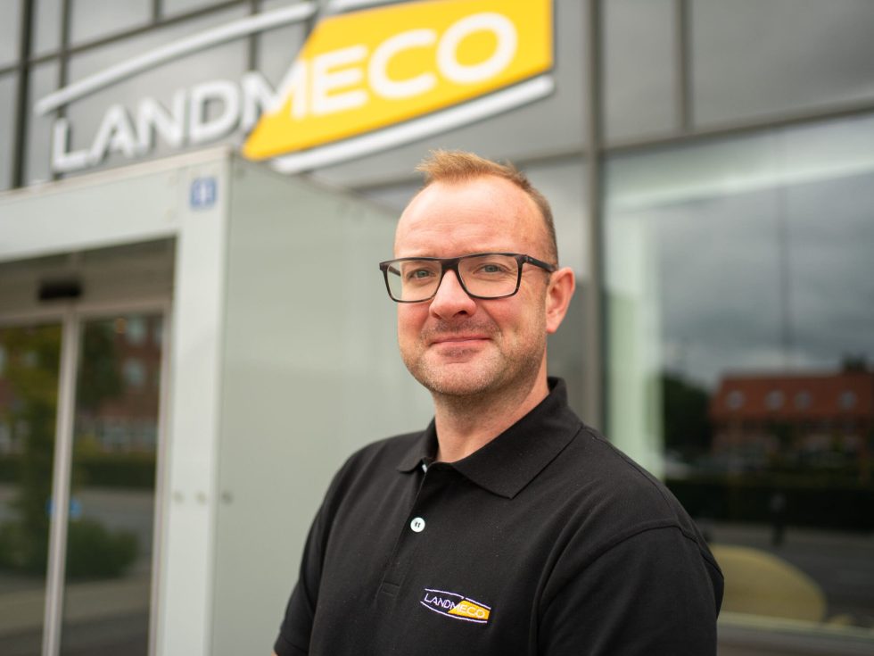 Morten Jakobsen wearing a LANDMECO polo shirt in front of the company headquarters in Ølgod, Denmark.