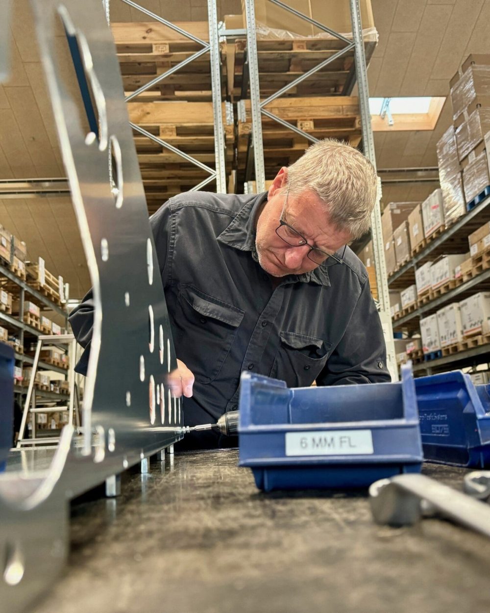 Per Leth assembling metal components for LANDMECO poultry systems in the Ølgod, Denmark production facility.