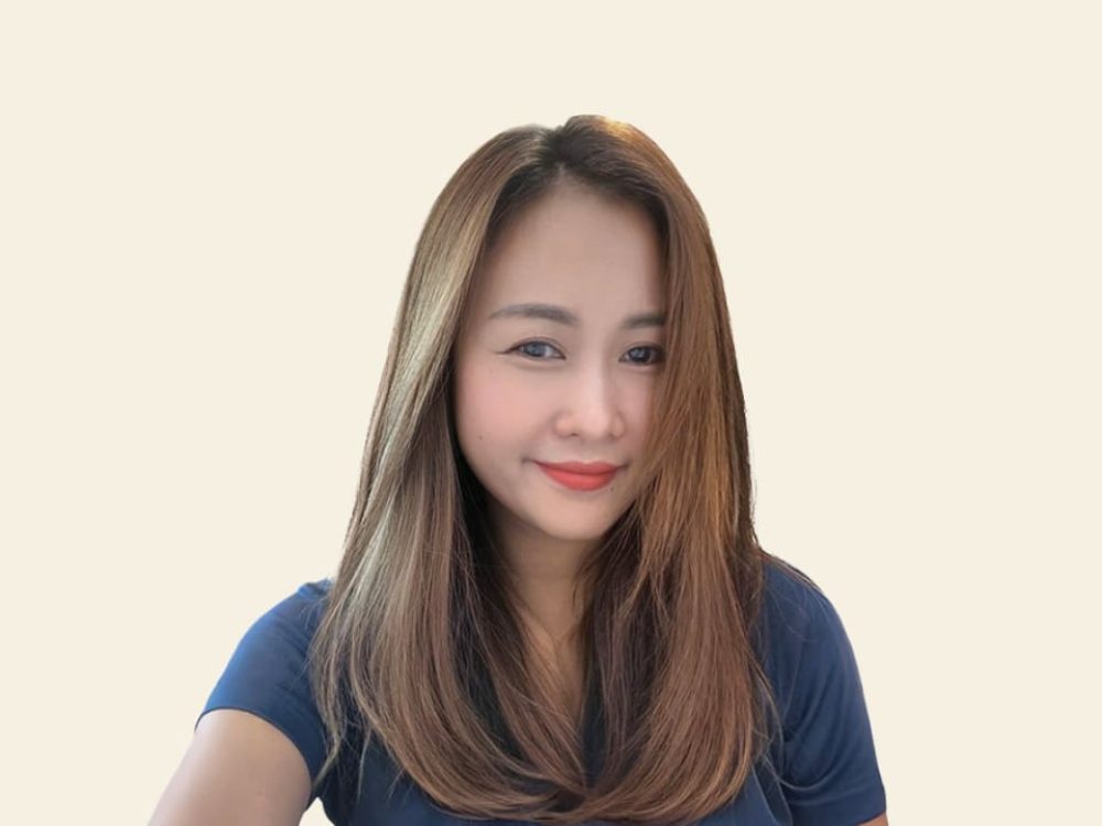 Portrait of Janjira Sarasook, Landmeco's Area Sales Manager in Thailand, specializing in poultry farming equipment.