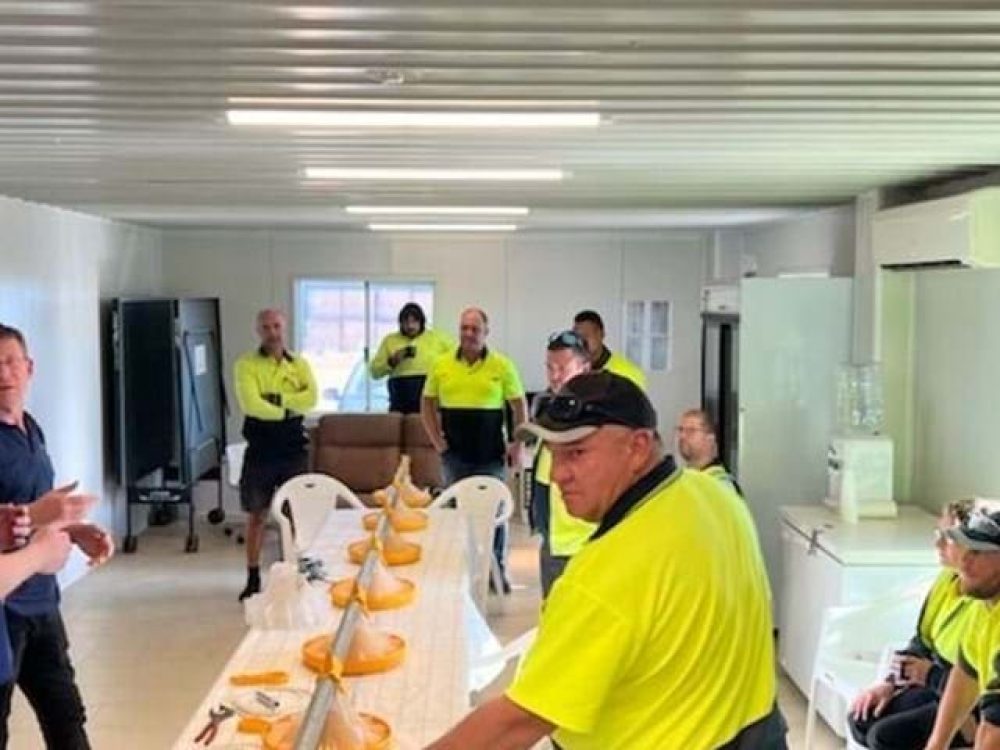 Farmmark team receiving technical training on LANDMECO broiler feeding systems and pan feeding technology.