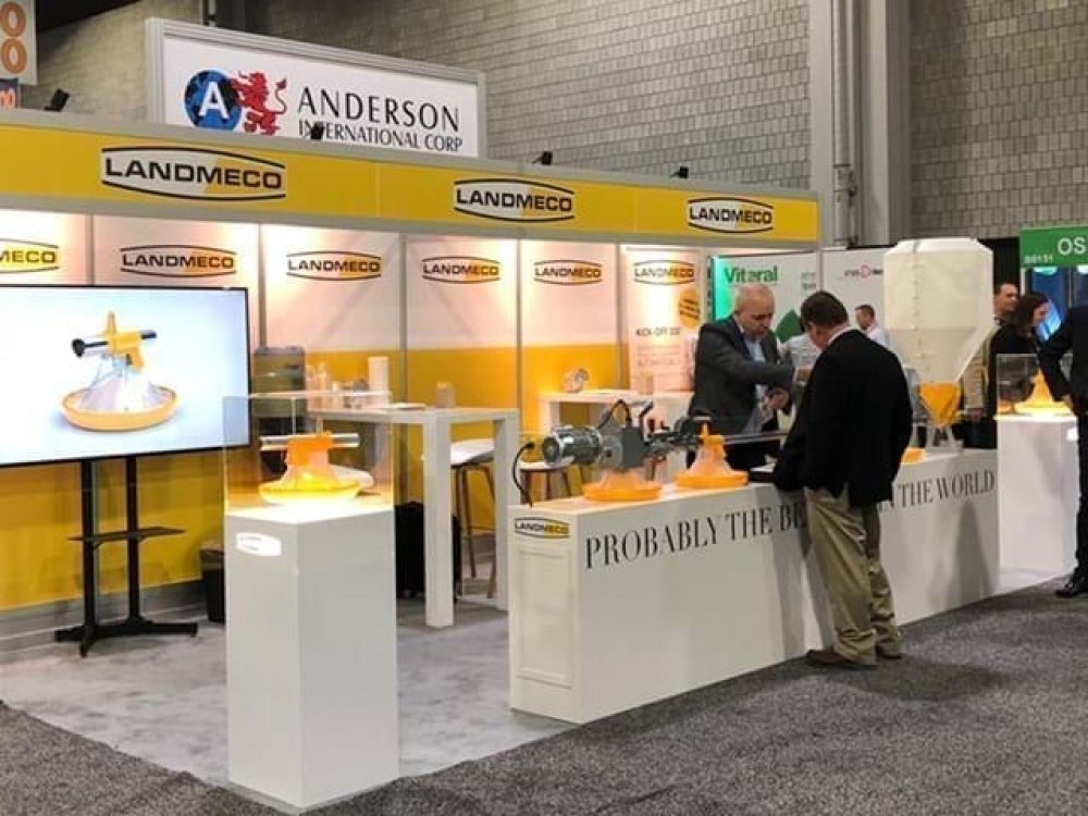 LANDMECO booth showcasing broiler feeding systems and poultry automation at an international trade exhibition.