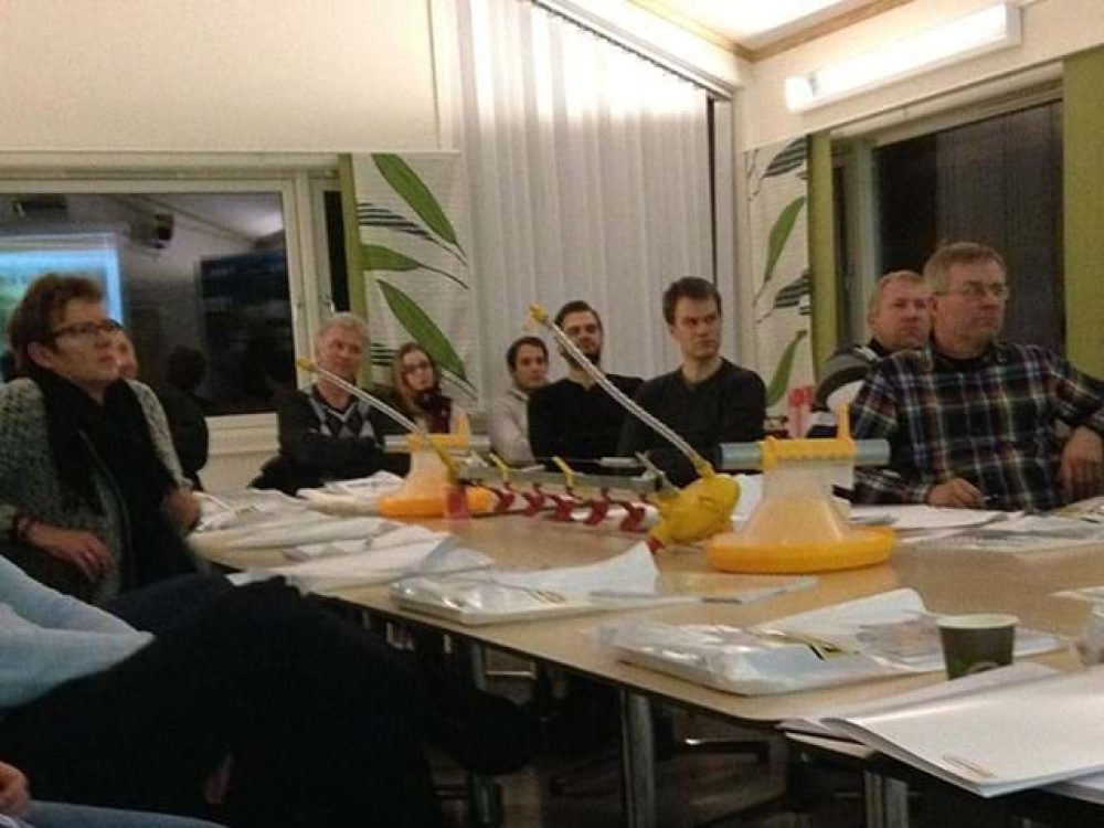 LANDMECO experts and partners reviewing automated poultry feeding systems at a technical product training session.